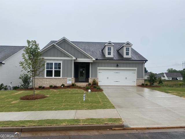179 Merwood Ln Unit 125, Jefferson, GA 30549 - craftsman house with board and batten siding, a garage, concrete driveway, a front lawn, and a shingled roof