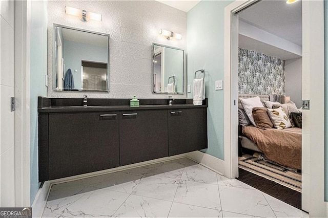 710 Oakview Rd, Decatur, GA 30030 - ensuite bathroom featuring double vanity, marble finish flooring, and baseboards