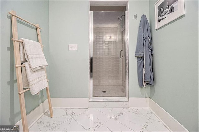 710 Oakview Rd, Decatur, GA 30030 - bathroom with marble finish flooring, a shower stall, and baseboards