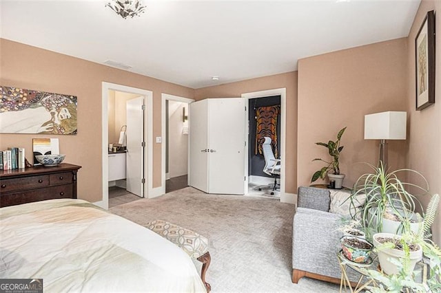 710 Oakview Rd, Decatur, GA 30030 - carpeted bedroom featuring a walk in closet, baseboards, and ensuite bath