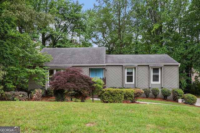 3006 Alberta Dr, Marietta, GA 30062 - mid-century modern home featuring a front lawn and roof with shingles