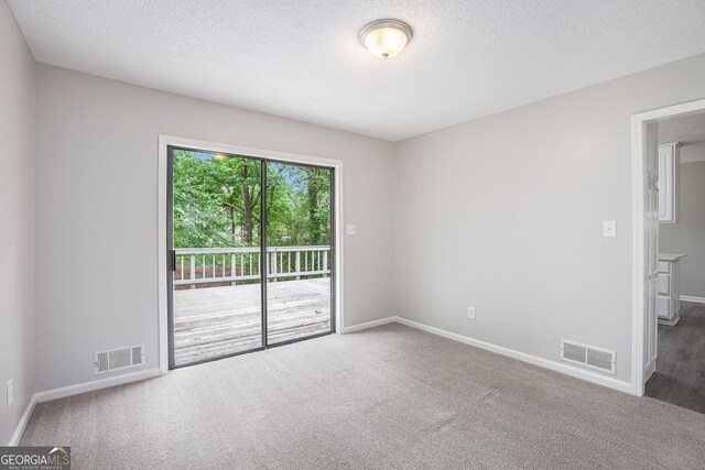 3006 Alberta Dr, Marietta, GA 30062 - spare room featuring carpet, baseboards, and a textured ceiling