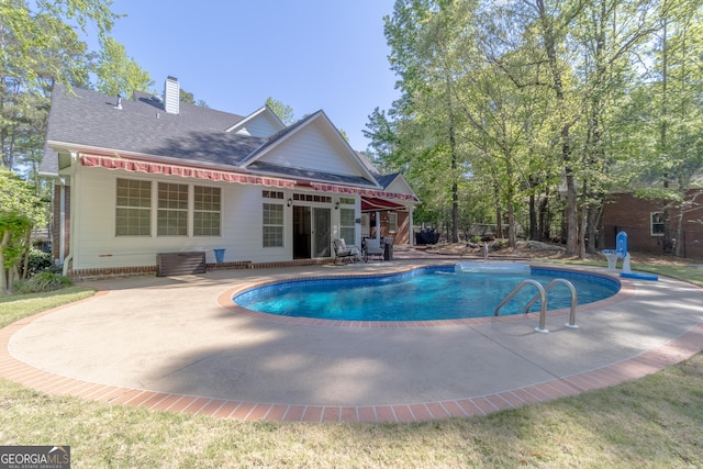 11389 Whitesville Rd, Fortson, GA 31808 - rear view of property featuring a patio, an outdoor pool, a chimney, and a shingled roof