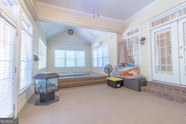 11389 Whitesville Rd, Fortson, GA 31808 - sunroom featuring a wall mounted AC, lofted ceiling, and a wood stove