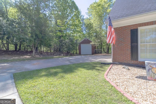 11389 Whitesville Rd, Fortson, GA 31808 - view of grassy yard with an outbuilding and concrete driveway
