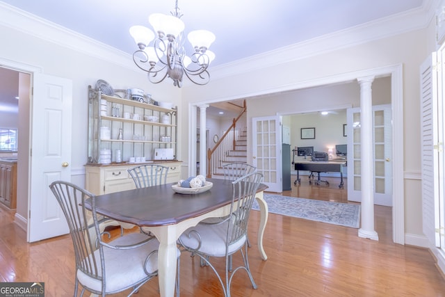 11389 Whitesville Rd, Fortson, GA 31808 - dining space with light wood finished floors, crown molding, an office area, stairs, and a chandelier