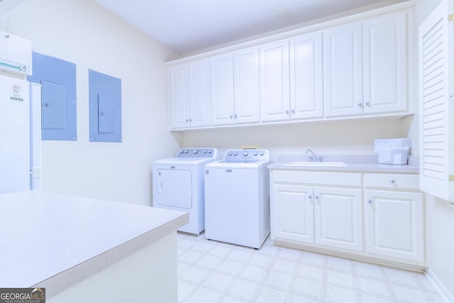 11389 Whitesville Rd, Fortson, GA 31808 - laundry room featuring electric panel, washing machine and clothes dryer, cabinet space, and light flooring