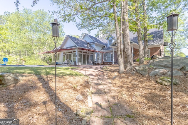 11389 Whitesville Rd, Fortson, GA 31808 - back of property with a sunroom and a patio area