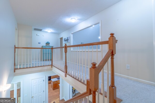 11389 Whitesville Rd, Fortson, GA 31808 - staircase with baseboards and a textured ceiling