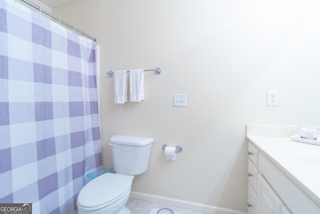 11389 Whitesville Rd, Fortson, GA 31808 - full bath with vanity, toilet, baseboards, tile patterned flooring, and a shower with shower curtain