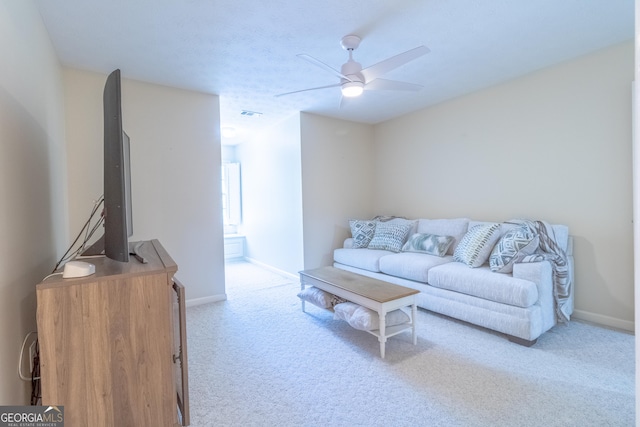 11389 Whitesville Rd, Fortson, GA 31808 - living area with carpet flooring, ceiling fan, and baseboards