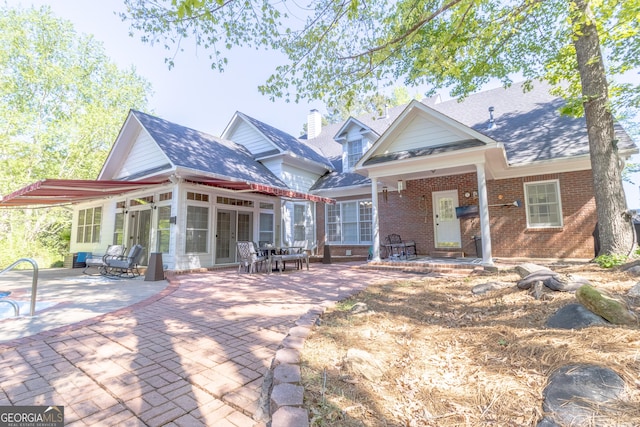 11389 Whitesville Rd, Fortson, GA 31808 - rear view of property with a patio area, brick siding, a sunroom, and a shingled roof