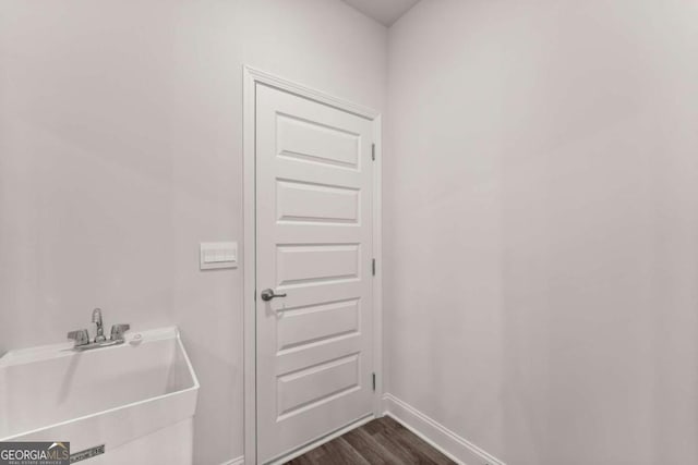 321 Magnolia Villas Dr, Cornelia, GA 30531 - bathroom featuring a sink, wood finished floors, and baseboards