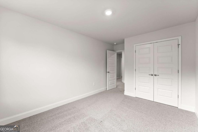 321 Magnolia Villas Dr, Cornelia, GA 30531 - unfurnished bedroom with carpet, baseboards, and a closet
