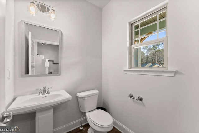 321 Magnolia Villas Dr, Cornelia, GA 30531 - bathroom featuring toilet and baseboards