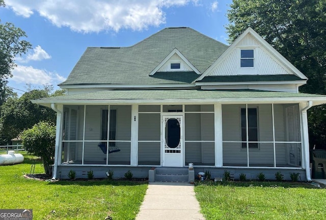44 Lee St, Concord, GA 30206 - view of front facade with a shingled roof, covered porch, and a front lawn