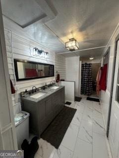 44 Lee St, Concord, GA 30206 - bathroom with marble look tile flooring, double vanity, and a shower