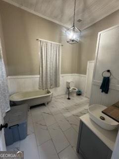44 Lee St, Concord, GA 30206 - full bath featuring wainscoting, vanity, and crown molding