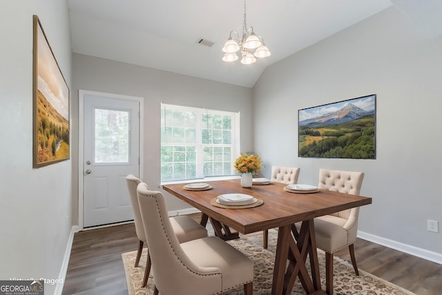 4695 Ravenwood Loop, Union City, GA 30291 - dining room with a chandelier, dark wood-style floors, vaulted ceiling, and baseboards