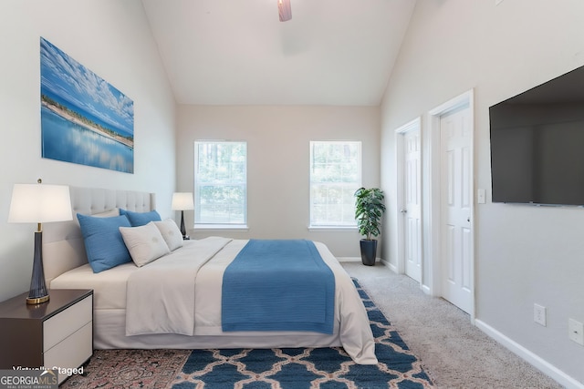 4695 Ravenwood Loop, Union City, GA 30291 - carpeted bedroom with vaulted ceiling, baseboards, and a ceiling fan