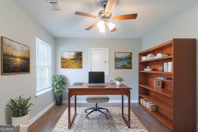 4695 Ravenwood Loop, Union City, GA 30291 - home office featuring dark wood-type flooring, ceiling fan, and baseboards