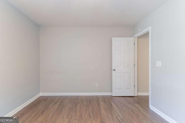 4695 Ravenwood Loop, Union City, GA 30291 - empty room with wood finished floors and baseboards