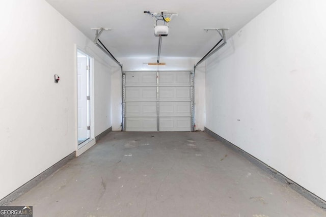 4695 Ravenwood Loop, Union City, GA 30291 - garage featuring a garage door opener and baseboards