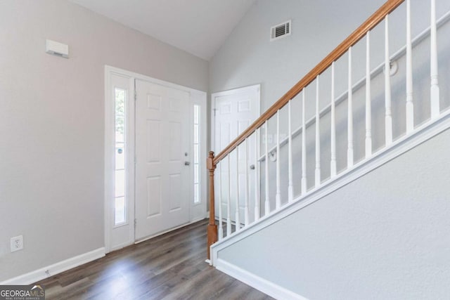 4695 Ravenwood Loop, Union City, GA 30291 - entryway with stairway, wood finished floors, healthy amount of natural light, baseboards, and high vaulted ceiling