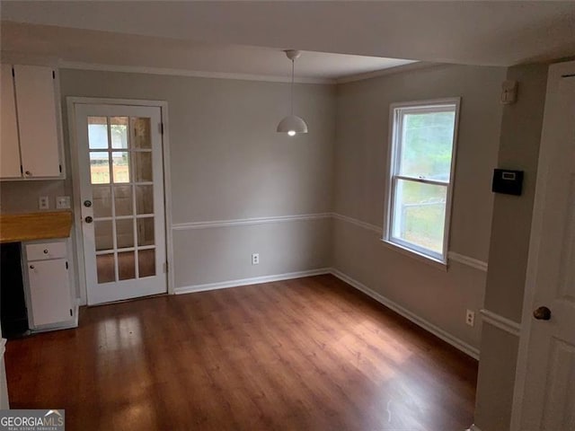4347 Barrington Pl, Macon, GA 31210 - unfurnished dining area featuring wood finished floors, healthy amount of natural light, baseboards, and ornamental molding