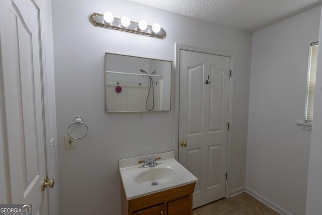 1385 Kinsey Town Rd, Cleveland, GA 30528 - bathroom with vanity, a textured ceiling, and tile patterned flooring