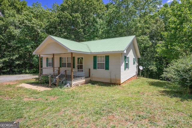 1385 Kinsey Town Rd, Cleveland, GA 30528 - view of front of home featuring a porch, a front yard, and metal roof