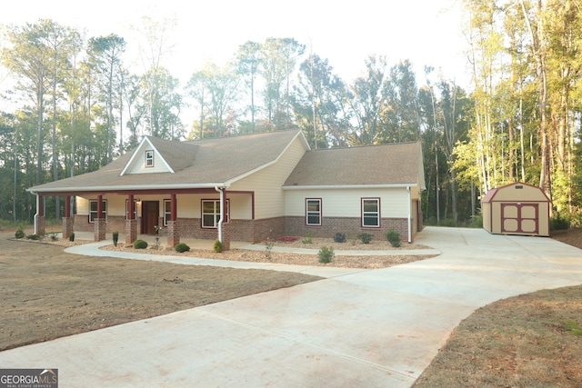 1663 Piedmont Rd, Griffin, GA 30224 - view of front of house featuring concrete driveway, brick siding, covered porch, and roof with shingles