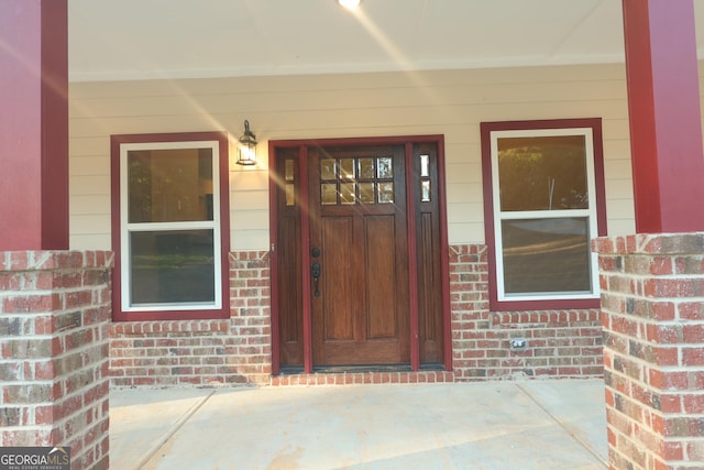 1663 Piedmont Rd, Griffin, GA 30224 - doorway to property featuring brick siding and a porch