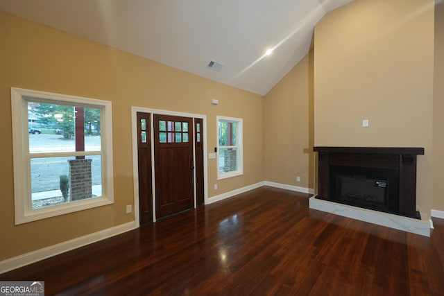 1663 Piedmont Rd, Griffin, GA 30224 - entrance foyer with wood finished floors, healthy amount of natural light, baseboards, and high vaulted ceiling