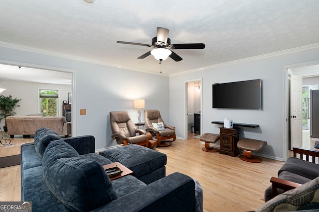 1560 Bubbling Creek Rd NE, Atlanta, GA 30319 - living area featuring light wood-style flooring, ceiling fan, crown molding, baseboards, and a textured ceiling