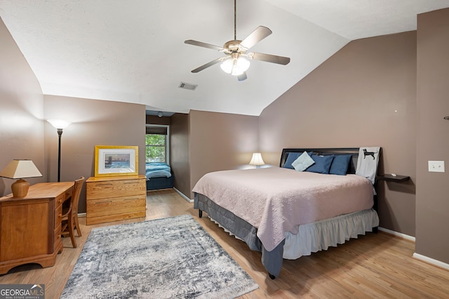 1560 Bubbling Creek Rd NE, Atlanta, GA 30319 - bedroom featuring lofted ceiling, baseboards, wood finished floors, and ceiling fan