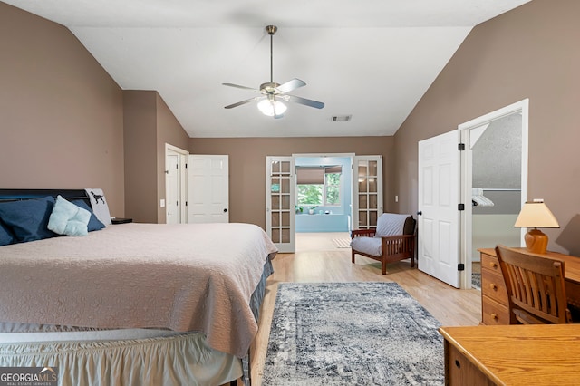 1560 Bubbling Creek Rd NE, Atlanta, GA 30319 - bedroom featuring vaulted ceiling, light wood-type flooring, and ceiling fan
