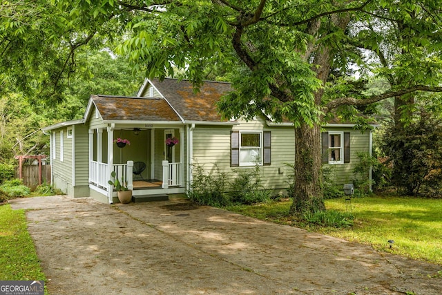 1682 Grace St SE, Atlanta, GA 30316 - bungalow with concrete driveway, a porch, and a shingled roof