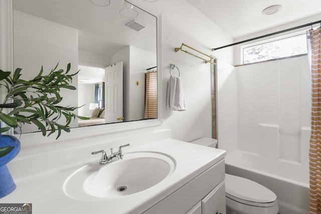 1682 Grace St SE, Atlanta, GA 30316 - bathroom featuring toilet, vanity, and shower / bath combo with shower curtain