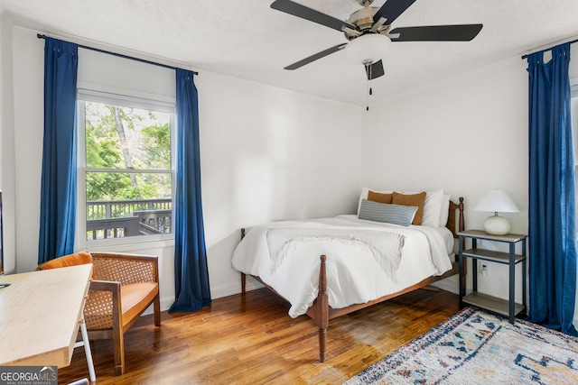 1682 Grace St SE, Atlanta, GA 30316 - bedroom with wood finished floors, a ceiling fan, and baseboards