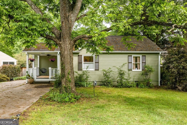 1682 Grace St SE, Atlanta, GA 30316 - view of front facade with a porch, a front lawn, and concrete driveway