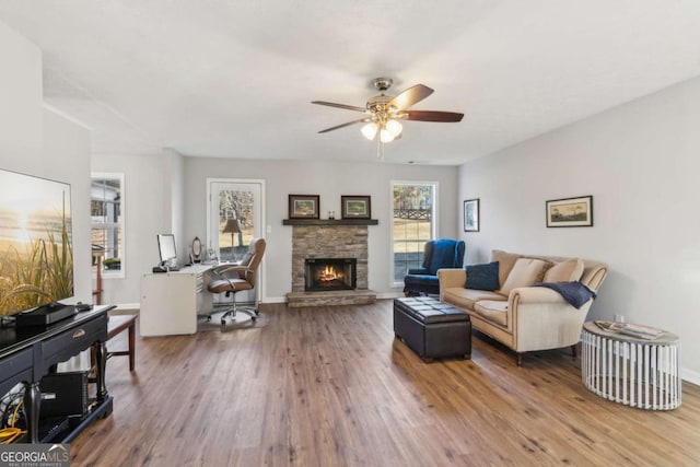 397 Harvey Lokey Rd, Bethlehem, GA 30620 - living room with ceiling fan, wood finished floors, a fireplace, and an office area