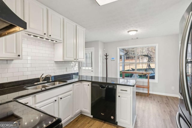 397 Harvey Lokey Rd, Bethlehem, GA 30620 - kitchen with black appliances, white cabinets, tasteful backsplash, and a peninsula