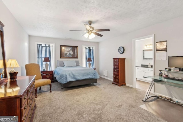 397 Harvey Lokey Rd, Bethlehem, GA 30620 - bedroom featuring light carpet, a textured ceiling, ensuite bathroom, and a ceiling fan