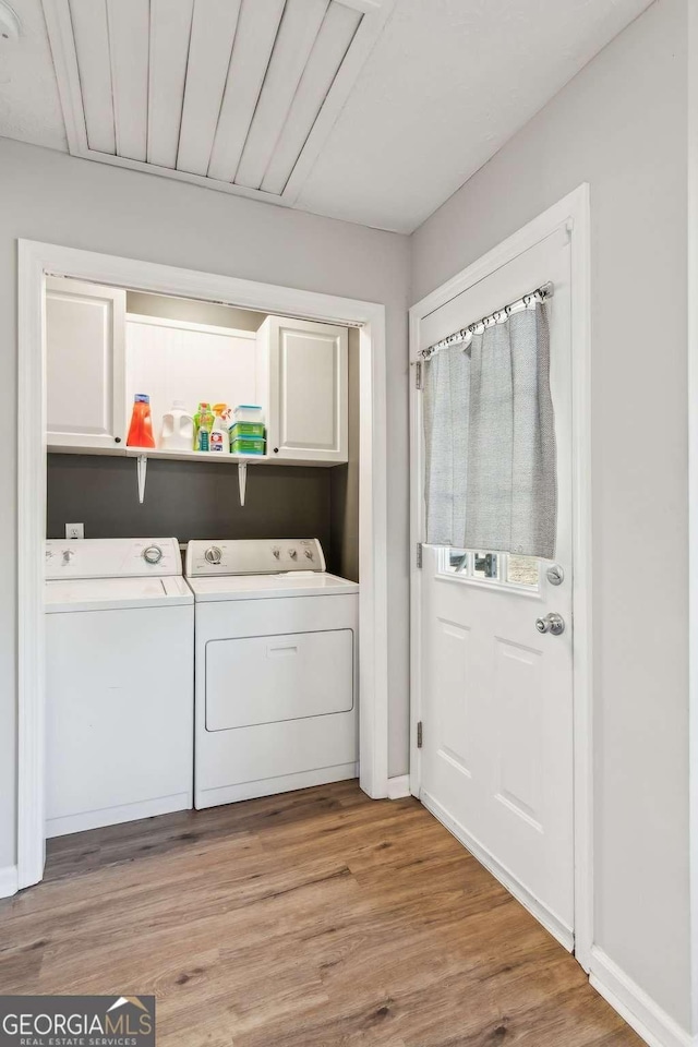 397 Harvey Lokey Rd, Bethlehem, GA 30620 - washroom featuring cabinet space, washer and dryer, and light wood finished floors