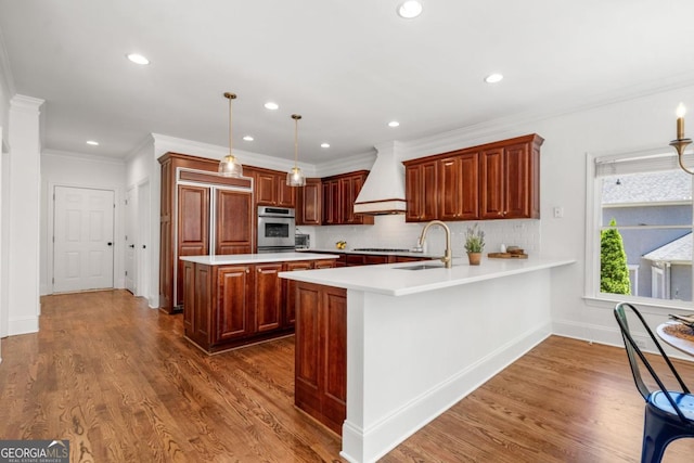 414 Dogwood Way, Canton, GA 30114 - kitchen with custom range hood, stainless steel oven, a sink, light countertops, and dark wood-style flooring