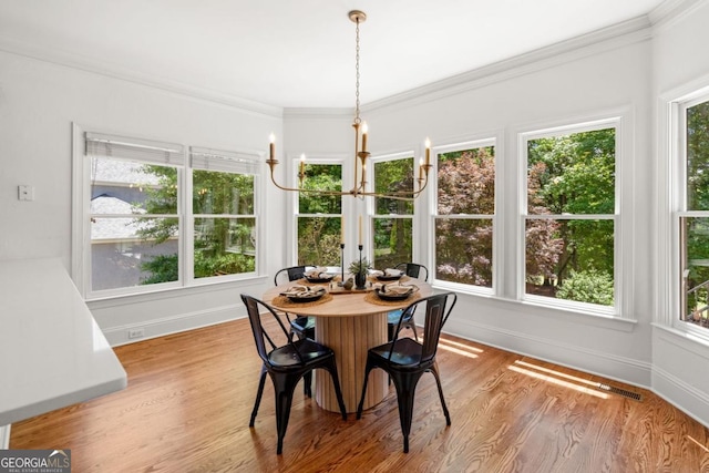 414 Dogwood Way, Canton, GA 30114 - dining space with baseboards, wood finished floors, crown molding, and a chandelier
