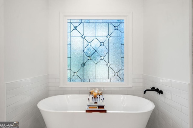 414 Dogwood Way, Canton, GA 30114 - full bath with tile walls, a soaking tub, a wainscoted wall, and healthy amount of natural light