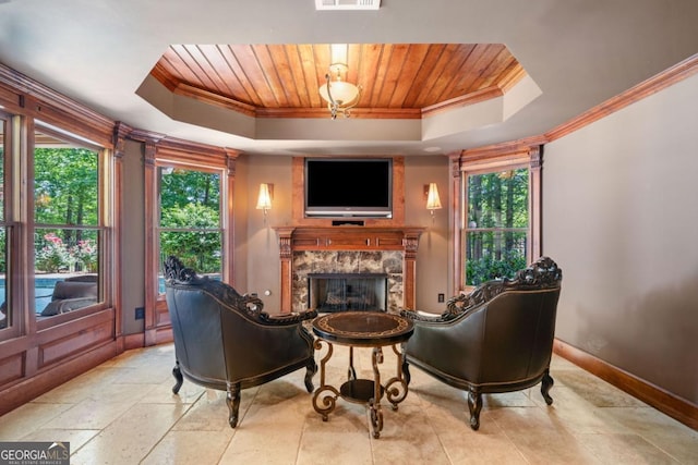 414 Dogwood Way, Canton, GA 30114 - living room featuring a raised ceiling, ornamental molding, wooden ceiling, baseboards, and a premium fireplace