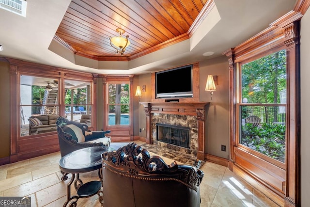 414 Dogwood Way, Canton, GA 30114 - living room with a raised ceiling, crown molding, baseboards, a premium fireplace, and wood ceiling